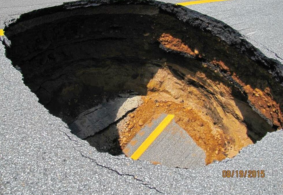Courtesy photo by N.H. Department of Transportation The stretch of I-93 where a sinkhole opened up Aug. 19 was built atop an older road, portions of which can be seen here. Below that is a century-old water line made of brick which failed, leading to the sinkhole.