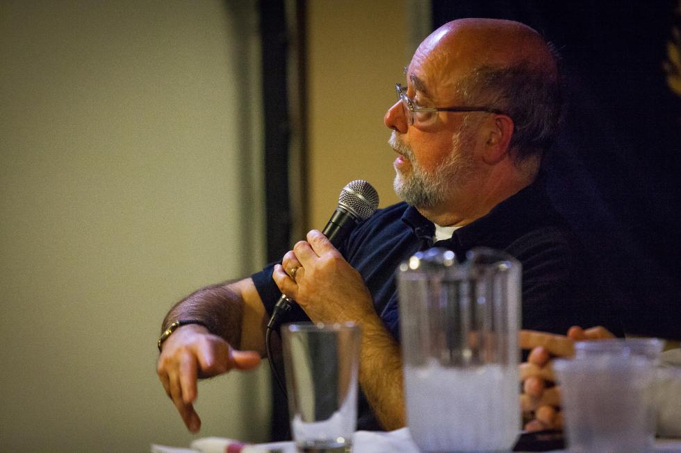 New Hampshire Chief Medical Examiner Thomas Andrew takes a question from the audience during Science Cafe at The Draft Sports Bar in Concord on Tuesday, Jan. 12, 2016. The panel theme was heroin and addiction.  (ELIZABETH FRANTZ / Monitor staff)
