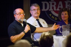New Hampshire Chief Medical Examiner Thomas Andrew takes a question from the audience during Science Cafe at The Draft Sports Bar in Concord on Tuesday, Jan. 12, 2016. The panel theme was heroin and addiction.  (ELIZABETH FRANTZ / Monitor staff) - ELIZABETH FRANTZ | Concord Monitor