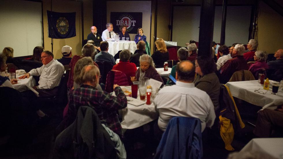 Panelists including New Hampshire Chief Medical Examiner Thomas Andrew, Concord Fire Chief Dan Andrus, Director of Substance Use Services at Concord Hospital Monica Edgar and Concord Hospital addiction specialist Molly Rossignol took questions from the audience during Science Cafe at The Draft Sports Bar in Concord on Tuesday, Jan. 12, 2016. The panel theme was heroin and addiction.  (ELIZABETH FRANTZ / Monitor staff)