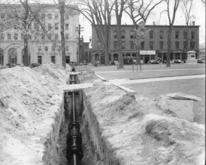 The original steam-heat pipes being laid in downtown Concord, 1938.