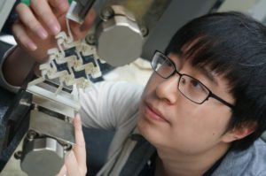 Yunyao Jiang, a doctoral candidate in mechanical engineering at UNH, using 3D-printed prototype to prove concept of sequential cell-opening mechanism. Credit: University of New Hampshire.