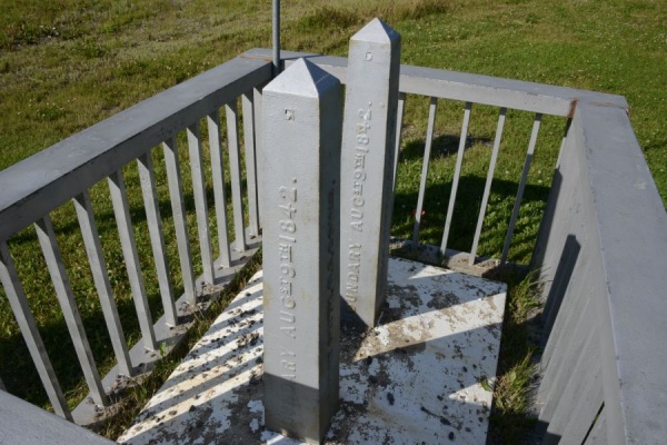 Why are there two obelisks, really close to each other, marking the NH border with Canada?