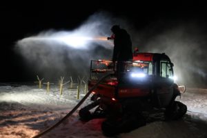 Site Manager Ian Halm sprays water over the ice farm at Hubbard Brook Experimental Forest on Feb. 19, 2019. (Photo:Claire Chaisson, HBEF)