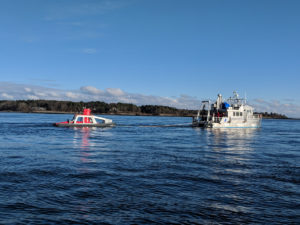 Testing an ASV in Portsmouth Harbor from the UNH/CCOM research vessel Gulf Surveyor. Credit: CCOM.
