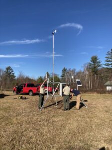 A crew sets up a Remote Automated Weather Station at the Warren Fish Hatchery. The solar-powered station is one of five that gathers data to help officials predict wildfires.