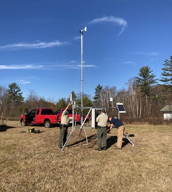 New weather station in Warren goes online – image of crew installing