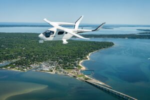Aerial photo of BETA electric aircraft flying